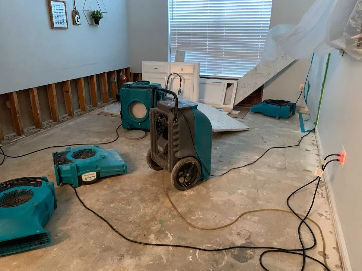 Dehumidifier in flood-cut room for Water Damage Restoration in Lowell